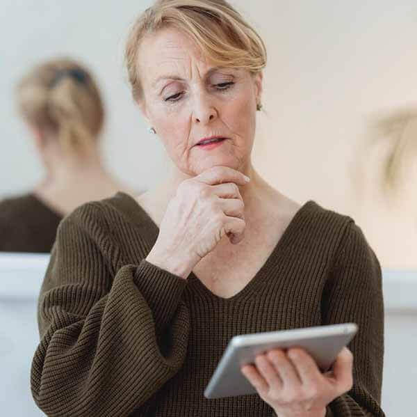 Elder looking at a tablet